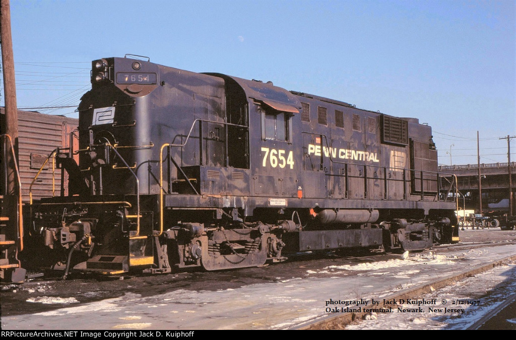 PC, Penn Central 7654 ALCO RS11, at Conrails, ex-LV Oak Island engine terminal, Newark, New Jersey. Feb 12, 1977.  